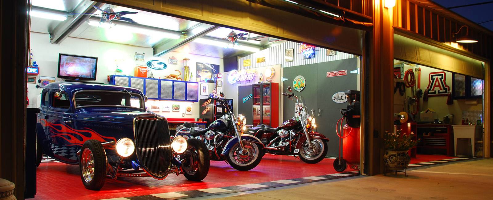 Vintage Car and a Harley Davidson Parked on a RaceDeck floored Home Garage